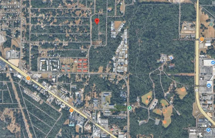 Satellite Map. Displaying an aerial view of a geographic area with roads, structures, and vegetation