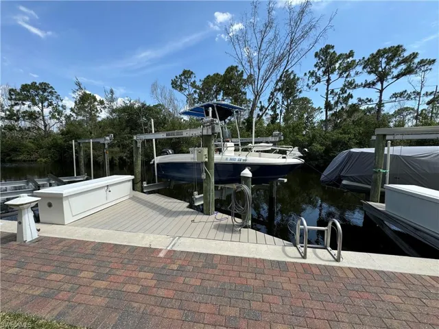 View of dock featuring a water view and boat lift