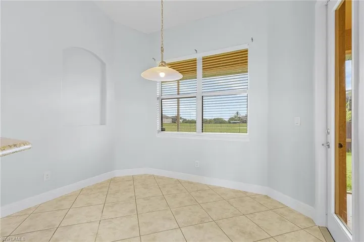 Breakfast nook off kitchen featuring light tile patterned floors