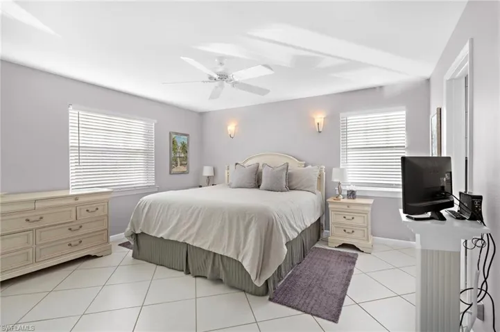 Bedroom featuring ceiling fan and light tile patterned flooring