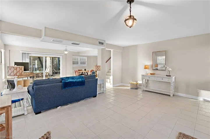 Tiled living room with ceiling fan