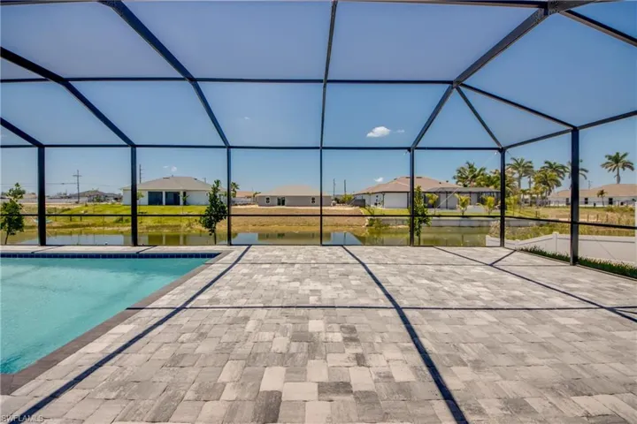 Outdoor pool with a patio, a water view, a lanai, and a residential view