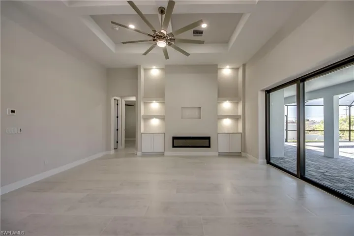 Unfurnished living room with visible vents, baseboards, recessed lighting, a ceiling fan, and light tile patterned floors