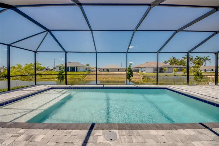 Pool featuring a residential view, a lanai, a water view, and a patio area