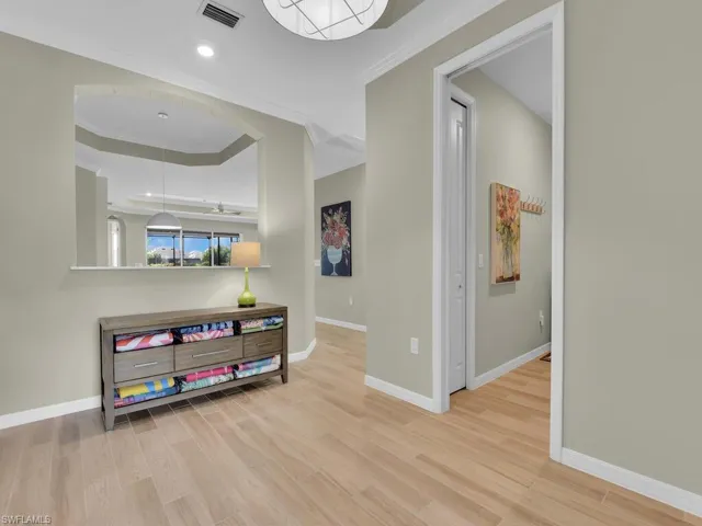 Foyer features a picture wall for added privacy from the main living area
