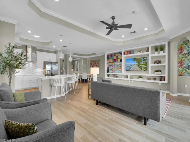Custom built-ins highlight this inviting, open-concept living room