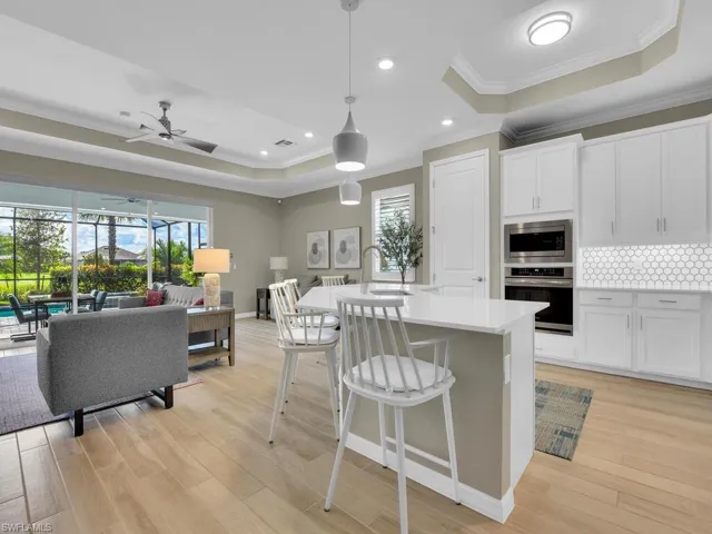 Open kitchen with a versatile island and custom tile details