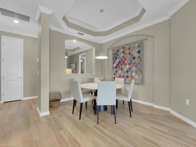 Charming dining nook with elegant tray ceilings