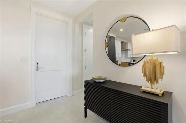 Hallway with baseboards and recessed lighting