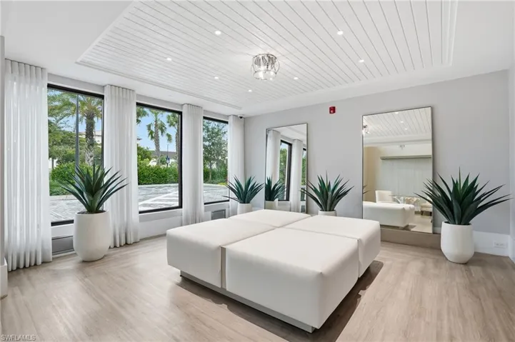 Bedroom with wood ceiling, light wood-style floors, and recessed lighting