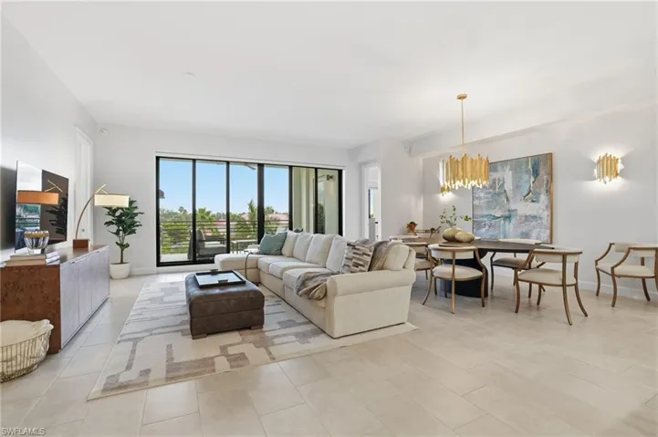 Living room featuring a chandelier and light tile patterned floors
