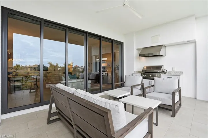 View of patio / terrace with ceiling fan, an outdoor hangout area, and a grill