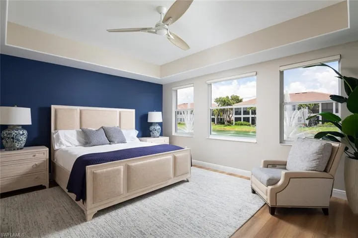 Bedroom with multiple windows, wood