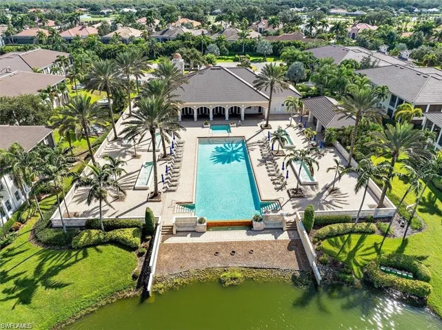 Aerial view of residential area featuring a pool area