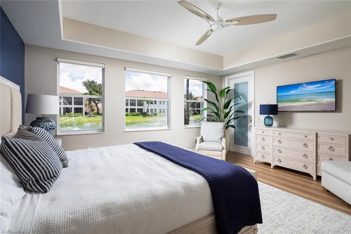 Bedroom with wood finished floors and ceiling fan