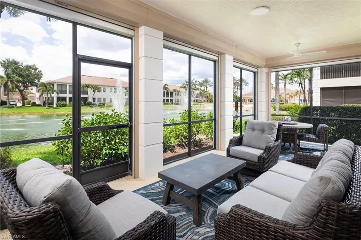 Sunroom featuring ceiling fan, an outdoor living space, and plenty of natural light
