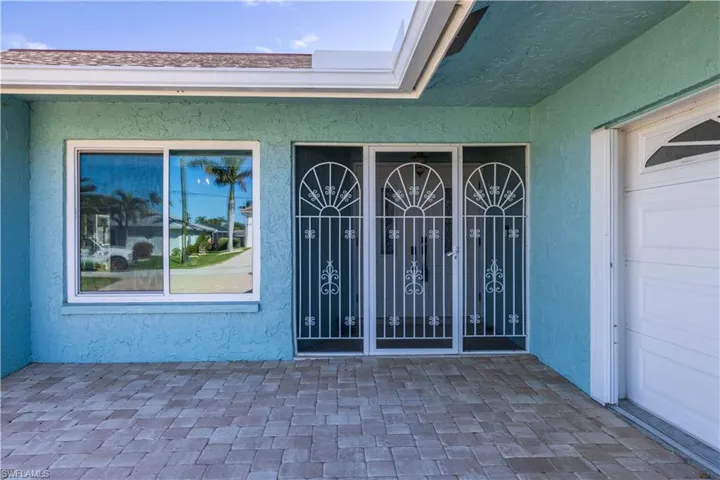 Property entrance with stucco siding