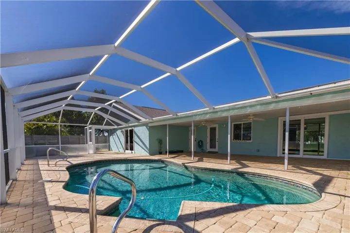View of pool featuring a fenced in pool, a patio area, fence, and ceiling fan
