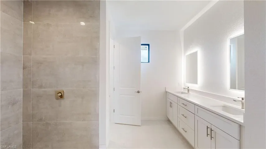 Full bath with double vanity and walk in shower
