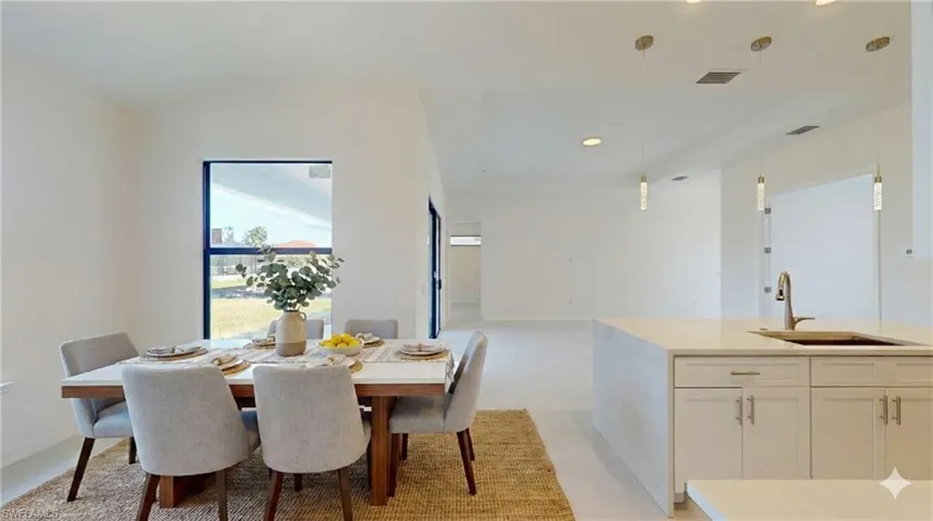 Dining space featuring recessed lighting