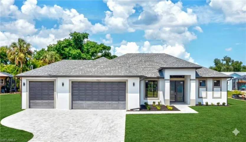 Prairie-style house featuring a front lawn, an attached garage, and stucco siding