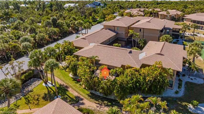 Aerial view of residential area with a tree filled landscape