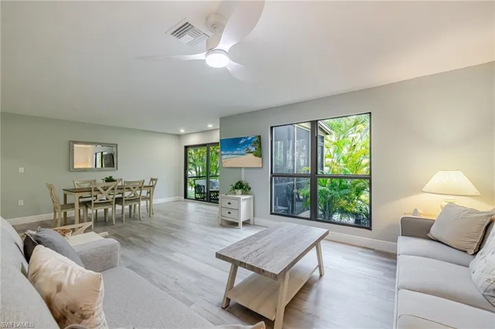 Living area featuring wood finished floors and ceiling fan