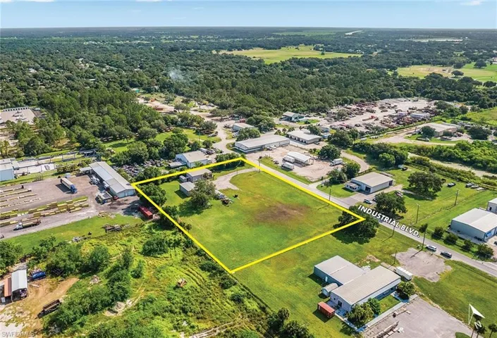 Aerial view of property and surrounding area with property boundaries highlighted