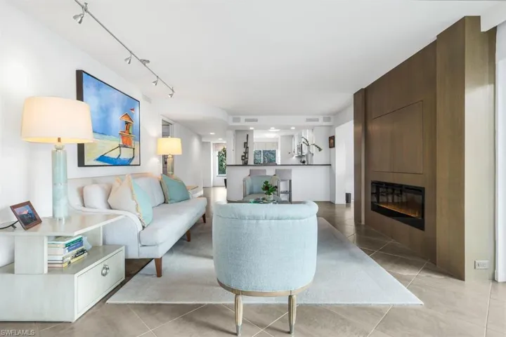 The Hidden TV and Fireplace Wall, built of fine woods, creates grand charm in the living room