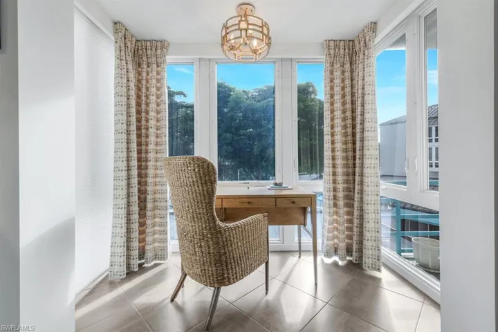 Desk setting has 3 sided glass surround