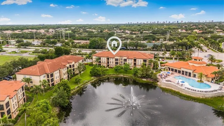 Drone / aerial view of skyline and a nearby body of water