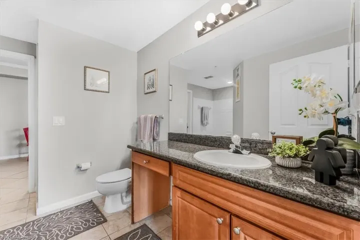 Bathroom featuring vanity and tile patterned flooring