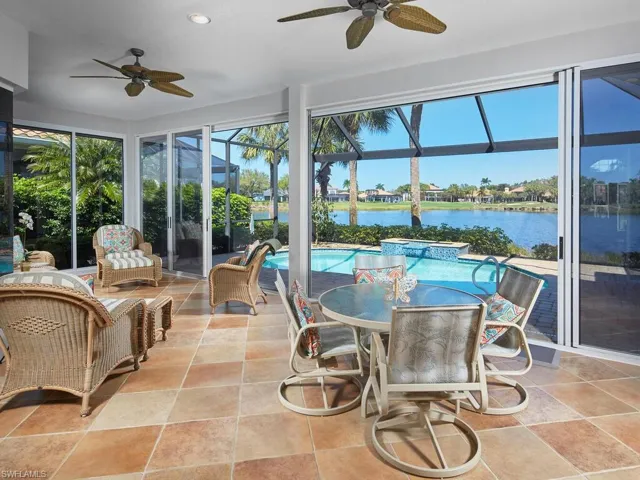 From Great Room sliding doors, one enters air conditioned and heated 405 sq. ft. Florida Room, glass enclosed or open...your option depending on the weather. Beyond is screened, window-picture lanai with resort pool.