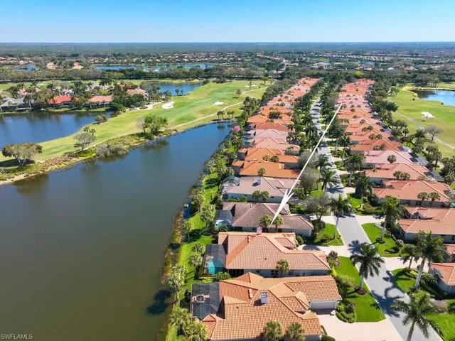 Ginger Pointe...53 houses looking from west to east. House is located at widest point of lengthy lake. South course fairway #6 to left (north) and fairway #4 to right (south). Street lined with majestic Royal Palms.