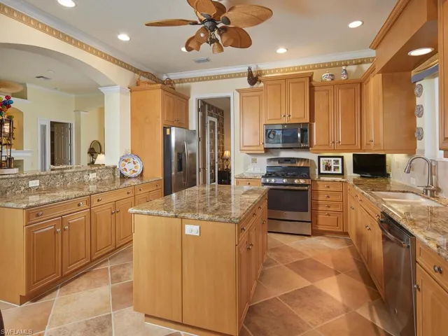 Kitchen with entry to adjacent Media Room and Great Room to left.
