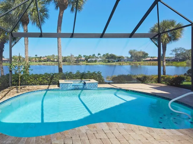 Free form lagoon pool, heated, recently Pebble Tec refinished. Pool cage screen with expansive "picture window."