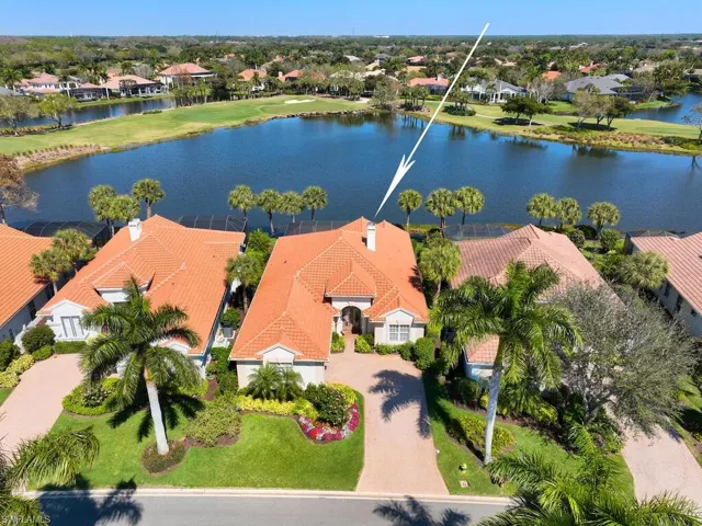 New roof 2021, beautifully landscaped with Royal Palms at front and majestic lake view from lanai