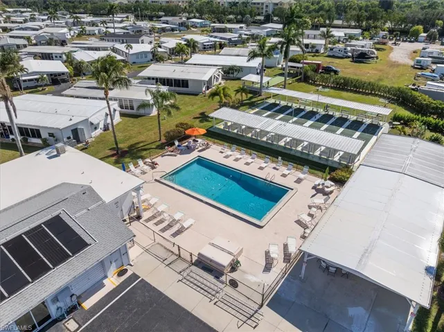 Aerial view of residential area featuring a pool