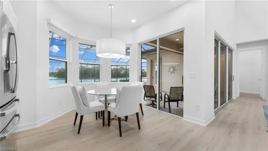 Dining space with light hardwood / wood-style floors