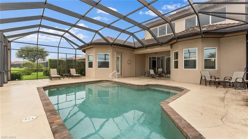 View of pool featuring a patio area and a lanai