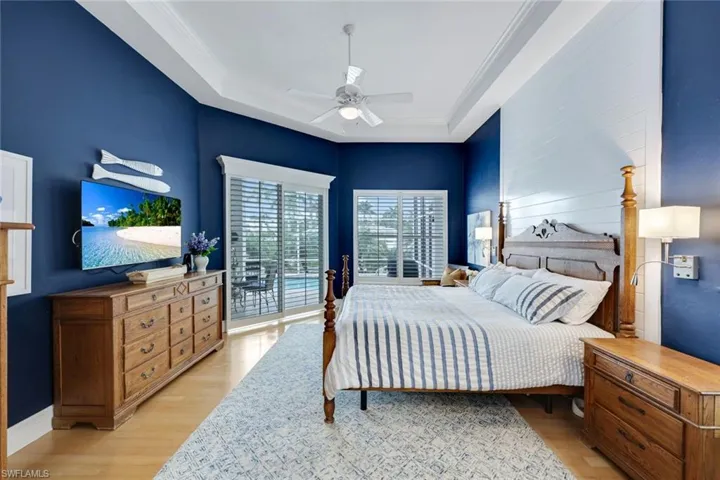 Privately tucked away on the Northern side of the home, the serene primary suite features a spacious, sunny bedroom with gorgeous wood flooring.