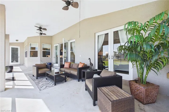 Screened Lani overlooking lake and lawn.