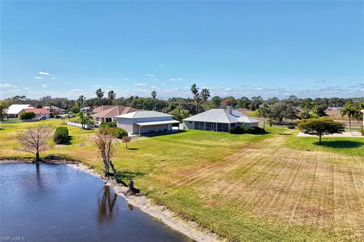 Back of home with lake view