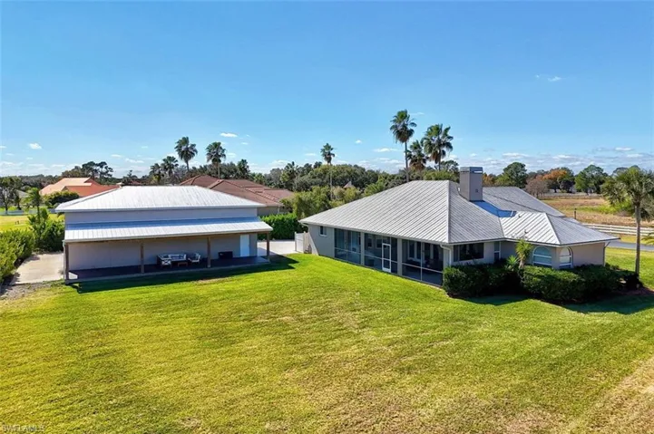 Back of home and detached garage