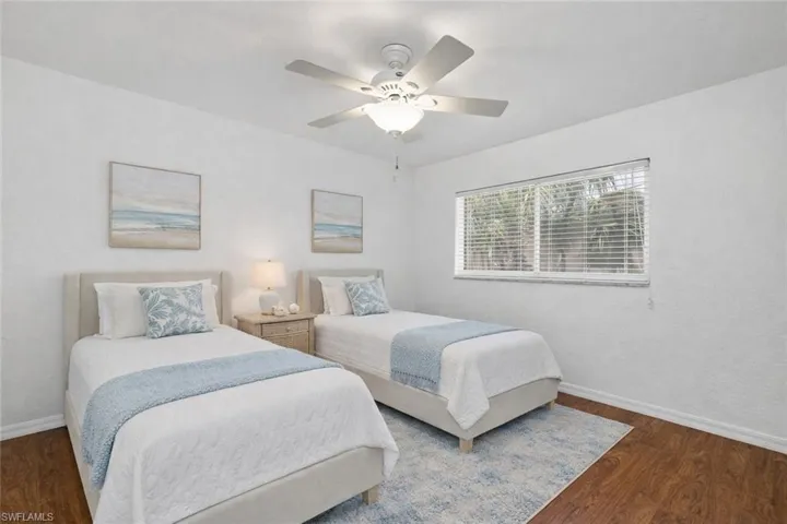 Bedroom with wood finished floors and a ceiling fan
