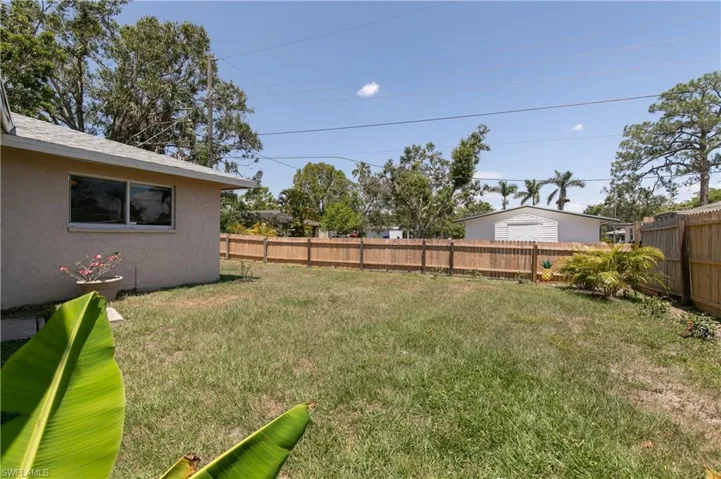 View of fenced backyard