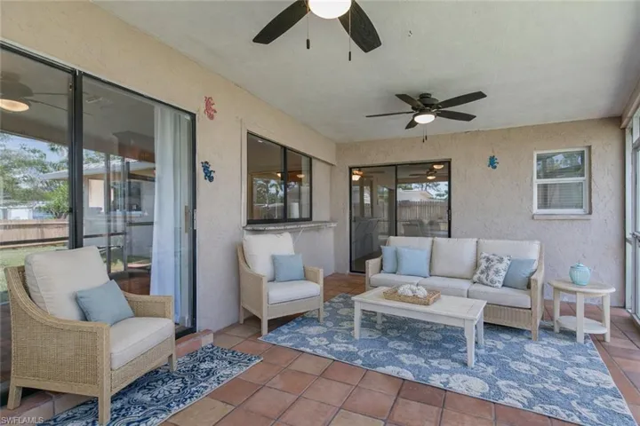 Sunroom featuring ceiling fan, an outdoor lounge area, and a patio