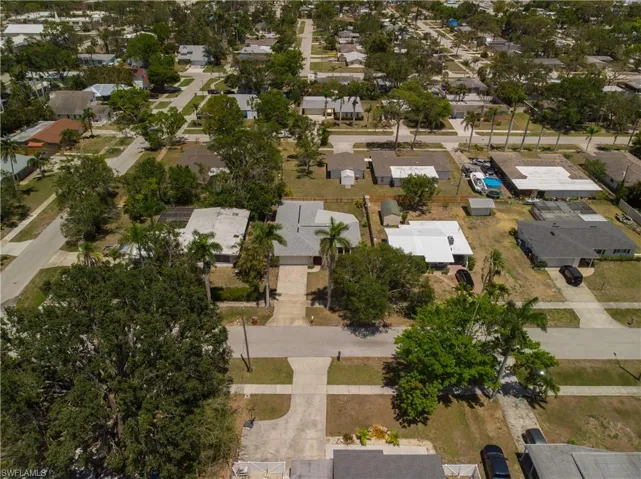 Aerial overview of property's location featuring nearby suburban area