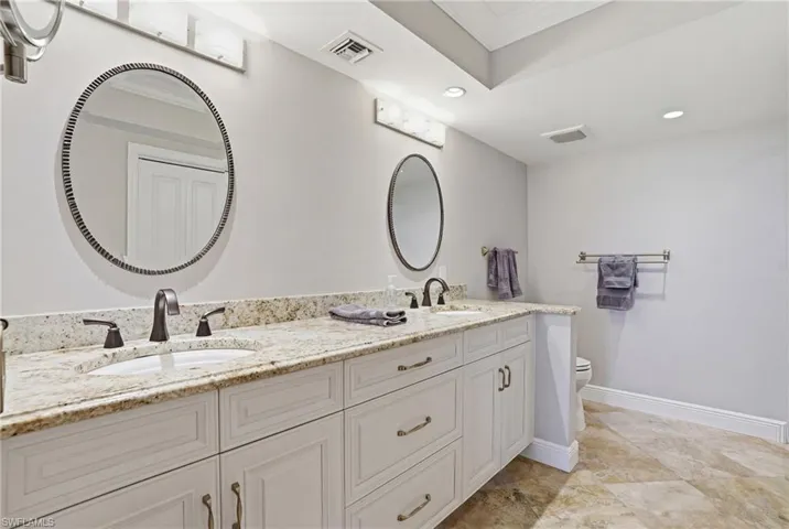 Double sink spacious vanity with plenty of cabinet space