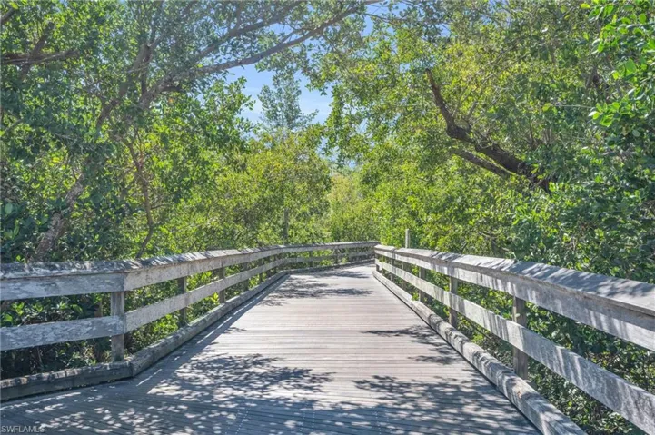 Beautiful boardwalks guide you through the mangroves to the beach by foot or tram